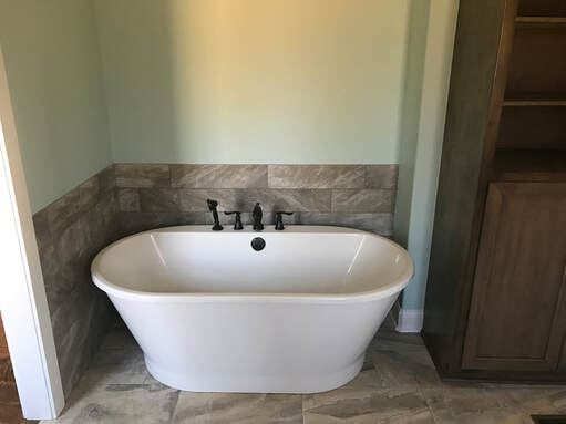 A bathroom remodel in Huntsville, AL completed by Recentered Restorations.